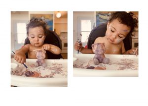 2 photos of infant painting
