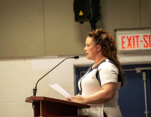 Alumnae Speaker: Young woman speaking at graduation