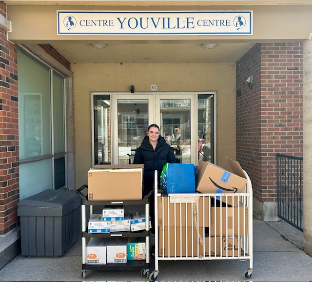 Ava dropping off a donation to Youville Centre in honor of her 19th birhday