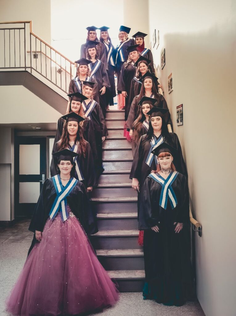 Youville Class of 2025 on the Stairs before Ceremony