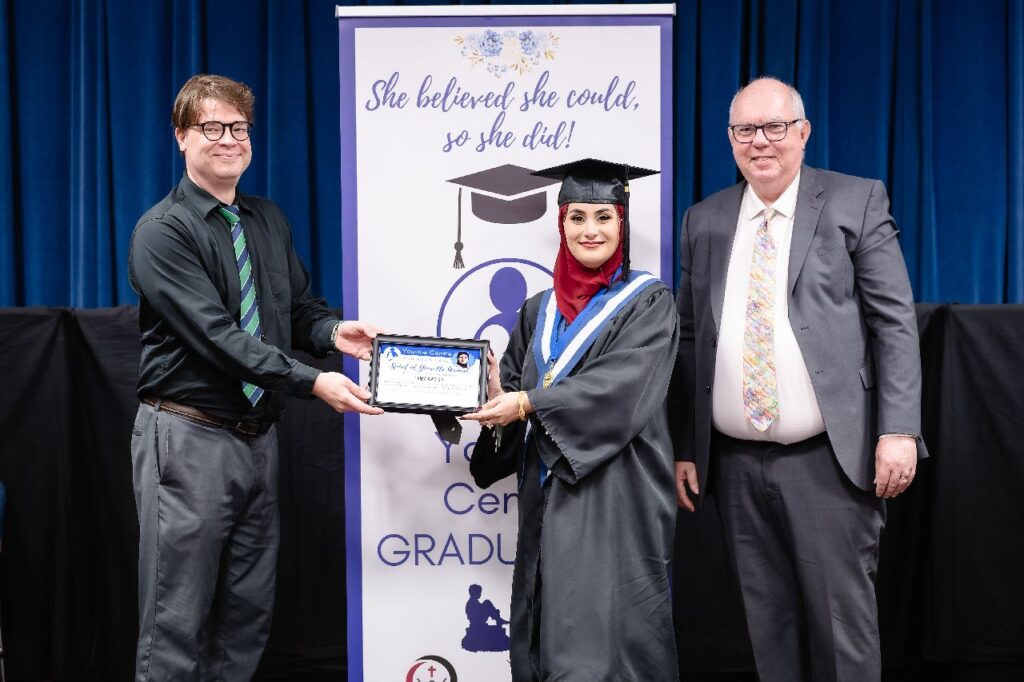 2025 Spirit of Youville Speaker pictured with ED Peter and Teacher Jonathan