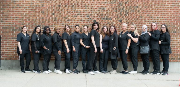 Group photo of Versailles Academy students who provided onsite hair appointments for our Youville 2025 graduates
